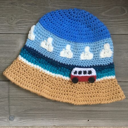 Crocheted Bucket Hat with image of seaside beach, sea and campervan